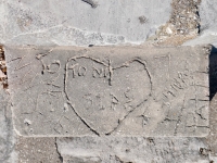 Love NW Side, Tony STPS in heart, arrow, Sandy 4 Patti. Chicago lakefront stone carvings, Calumet Park. 2024