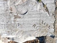 I, Jab(ber?), WE, R.G., ZLFZ. Chicago lakefront stone carvings, Calumet Park. 2024