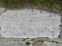 Autograph rock: Beatles with peace symbol. Mouse, Bedja, D.K., Zup, Glen, Kelly, P.M., MB, Ham, Chap, ER, others. Chicago lakefront stone carvings, Calumet Park. 2019