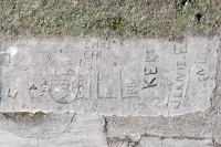 Autograph rock: Jill, John, Brad, Mike, Rich, Chris, Mai, Edie, Jeanie E., Lori, LQA, C, KE, others. Chicago lakefront stone carvings, Calumet Park. 2024