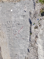 Alan (with pitchfork), apparently adapted from VEE, VS, DR. Chicago lakefront stone carvings, Calumet Park. 2024