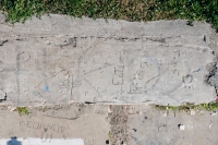 Autograph rock: Guy, Kelly, Ray, PH, DF, ET, others, and a swastika. Chicago lakefront stone carvings, Calumet Park. 2020