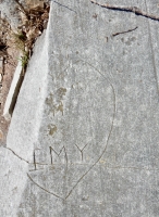 Broken heart, with IMY. Chicago lakefront stone carvings, Calumet Park. 2019