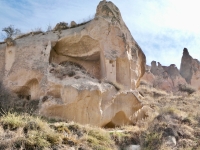 Exposed wall painting at the Zelve Open Air Museum, a UNESCO site with former cave dwellings, chapels and more. The outer walls mostly eroded and collapsed.