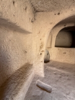 Winery at Zelve Open Air Museum, a UNESCO site with former cave dwellings, chapels and more. The large opening onthe right is where grapes were loaded to be crushed. The small opening on the floor is where the juice drained and was gathered.