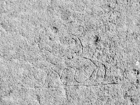 Reclining figure underneath Bob, Elly, Karen, Donna, Bradley. Chicago lakefront stone carvings, Foster Avenue Beach. 2023