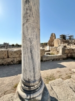 Graffitied pillar with inscription and creature