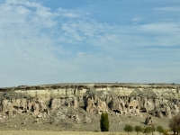 Cappadocian landscape with cave dwellings.