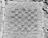 Checkerboard, detail. Chicago lakefront stone carvings, between 45th Street and Hyde Park Blvd. 2018