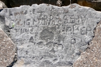 Autograph rock: John, Todo, Zigmond S., Steve Barber, Buns, Acorn, others. Chicago lakefront stone carvings, between 45th Street and Hyde Park Blvd. 2020