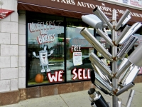 Muffler tree and window at 6 Stars Auto Body in November 2011, Lawrence Avenue near Sacramento