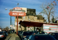 Economy Auto Mart, Western Avenue near Roscoe. Formerly a hot dog and/or hamburger sign and stand. Photo c. 1995