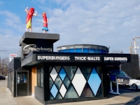 Higher prices and no Vienna dogs, but swell architecture, car service, and those figures have made Superdawg on Milwaukee Avenue at Devon Chicago