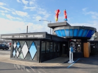 Higher prices and no Vienna dogs, but swell architecture, car service, and those figures have made Superdawg on Milwaukee Avenue at Devon Chicago